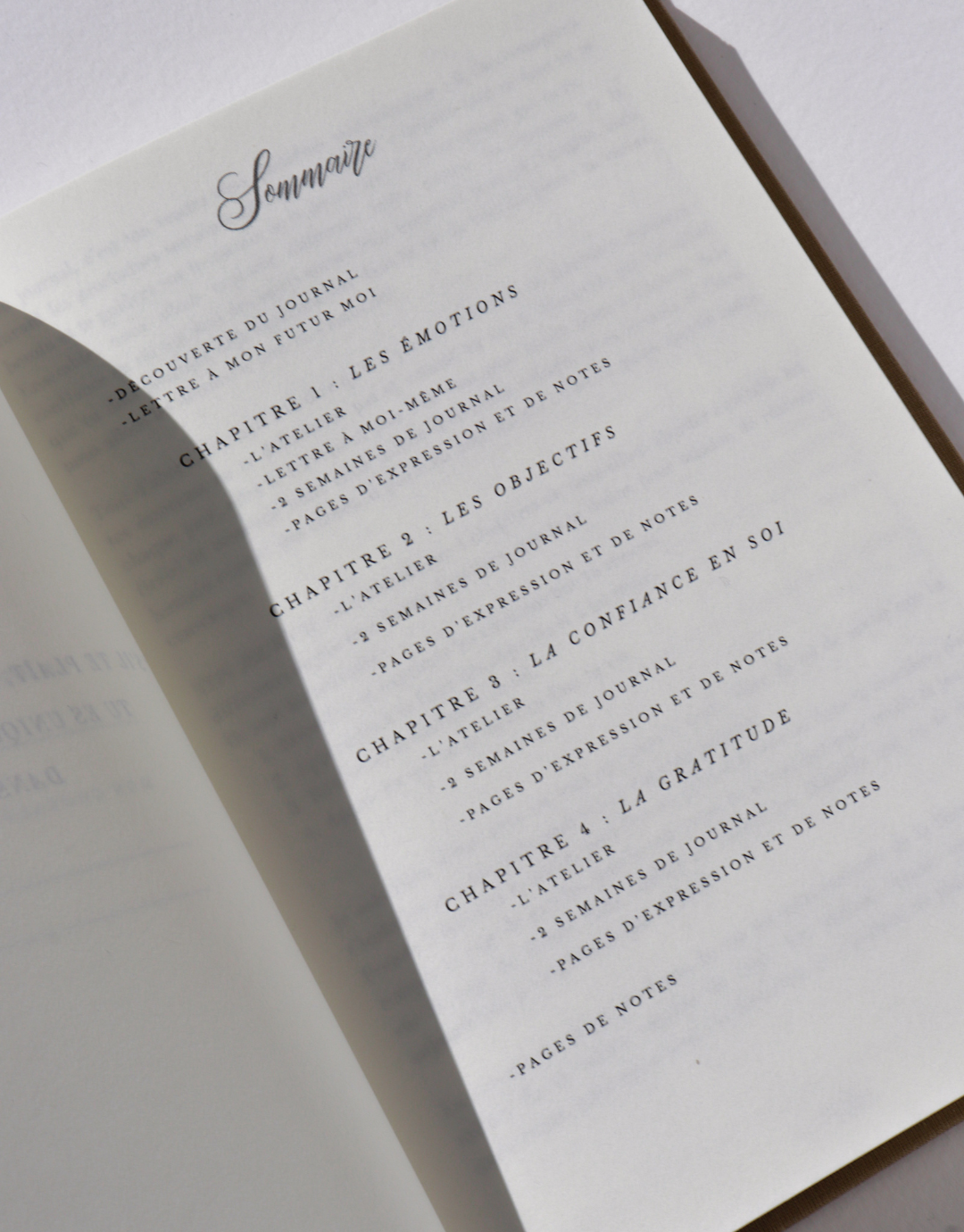 Sommaire du journal pour enfants Unile, présentant les différents chapitres axées sur la santé mentale, les émotions, la confiance en soi, les objectifs et la gratitude.